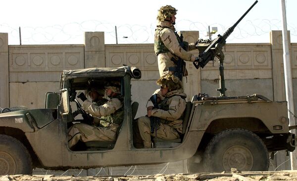 US soldiers from the 1st Battalion, 22nd Regiment of the 4th Infantry Division, ride on a military vehicle as they leave their base on a mission in Tikrit, 180 Kilometers (110 miles) north of Iraqi capital Baghdad, 30 December 2003. US soldiers from the 1st Battalion, 22nd Regiment of the 4th Infantry Division, ride on a military vehicle as they leave their base on a mission in Tikrit, 180 Kilometers (110 miles) north of Iraqi capital Baghdad, 30 December 2003. - Sputnik International