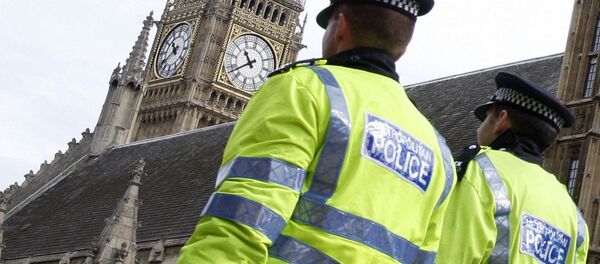 Police officers patrol past The Houses of Parliament in London. Police officers patrol past The Houses of Parliament in London. - Sputnik International