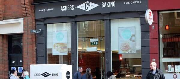 Pedestrians and customers walk by a branch of Ashers Baking Company in Belfast Pedestrians and customers walk by a branch of Ashers Baking Company in Belfast - Sputnik International