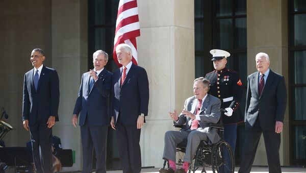 President Barack Obama stands with former presidents George W. Bush, Bill Clinton, George H.W. Bush, and Jimmy Carter. - Sputnik International