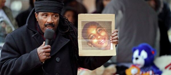 Activist Art McCoy holds a photo of Tamir Rice before a protest march at Cudell Park in Cleveland, Ohio. Activist Art McCoy holds a photo of Tamir Rice before a protest march at Cudell Park in Cleveland, Ohio. - Sputnik International