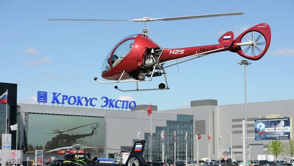 A Dynali H2S helicopter by Moscow's Crocus Expo exhibition hall before the HeliRussia 2015 expo. - Sputnik International