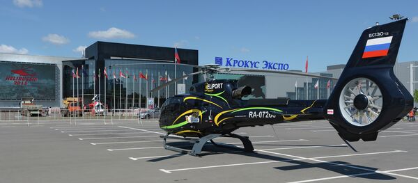 A Eurocopter EC-130T2 helicopter by Moscow's Crocus Expo exhibition hall before the HeliRussia 2015 expo. - Sputnik International