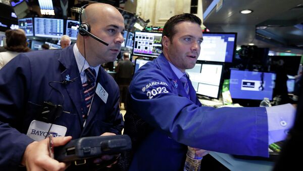 Trader Fred DeMarco, left, and specialist Frank Masiello work on the floor of the New York Stock Exchange Thursday, May 21, 2015 - Sputnik International