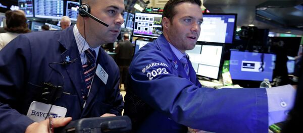 Trader Fred DeMarco, left, and specialist Frank Masiello work on the floor of the New York Stock Exchange Thursday, May 21, 2015 Trader Fred DeMarco, left, and specialist Frank Masiello work on the floor of the New York Stock Exchange Thursday, May 21, 2015 - Sputnik International