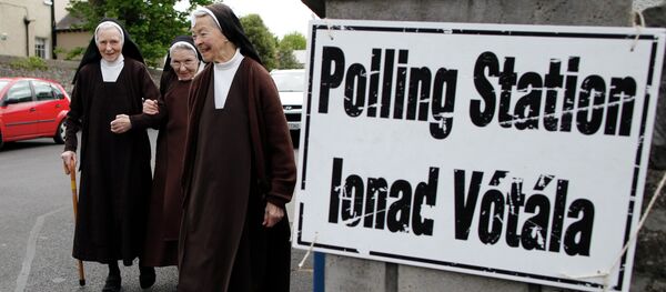 Carmelite sisters leave a polling station in Malahide, County Dublin, Ireland, Friday, May 22, 2015. Ireland began voting Friday in a referendum on gay marriage. Carmelite sisters leave a polling station in Malahide, County Dublin, Ireland, Friday, May 22, 2015. Ireland began voting Friday in a referendum on gay marriage. - Sputnik International