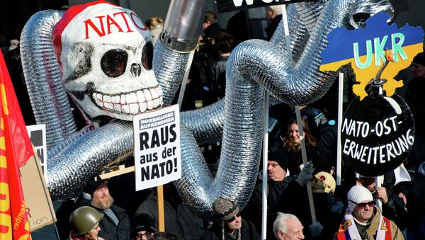 Demonstrators take part in a protest titled There is no Peace with NATO in front of the venue of the 51st Munich Security Conference (MSC) in Munich, southern Germany. - Sputnik International