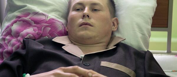 Alexander Alexandrov, who says he is a sergeant with the Russian special forces from the Volga River city of Togliatti, lies in a military hospital bed, in Kiev, Ukraine, Tuesday, May, 19, 2015 - Sputnik International