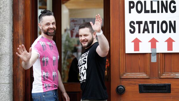 Partners Adrian, left and Shane, arrive to vote at a polling station in Drogheda, Ireland, Friday, May 22, 2015 - Sputnik International