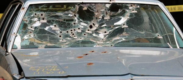 The car driven by Timothy Russell is shown Friday, April 10, 2015, in Cleveland. Cleveland police officer Michael Brelo, 31, was found not guilty of voluntary manslaughter in the November 2012 deaths of Russell, 43, and Malissa Williams, 30, after a high-speed chase. - Sputnik International