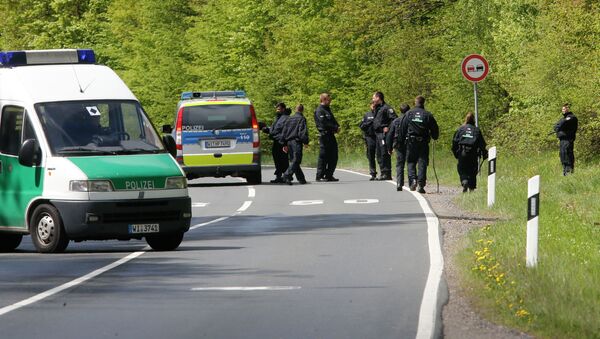 German police officers search for evidence in a forest near Oberursel, Germany, Thursday, April 30, 2015 - Sputnik International