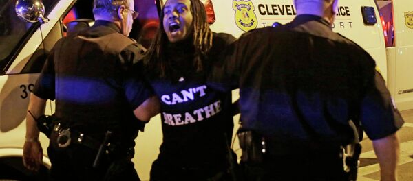 A protester is arrested after the acquittal of Michael Brelo, a patrolman charged in the shooting deaths of two unarmed suspects Saturday, May 23, 2015, in Cleveland - Sputnik International