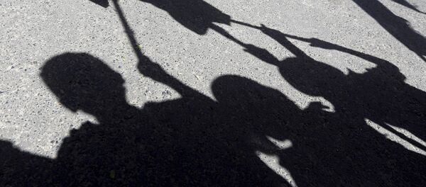 Shadows of children are reflected on the ground as they participate in an anti-Saudi protest outside the United Nations headquarters in Sanaa May 14, 2015 Shadows of children are reflected on the ground as they participate in an anti-Saudi protest outside the United Nations headquarters in Sanaa May 14, 2015 - Sputnik International
