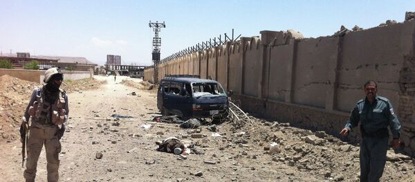 An insurgent's body lies on a street after he was shot to death near the provincial council building in Qalat in Zabul province, southwest of Kabul, Afghanistan, Monday, June 10, 2013 - Sputnik International