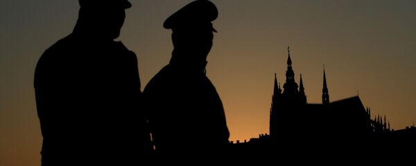 Czech policemen stand guard backdropped by Prague's castle Czech policemen stand guard backdropped by Prague's castle - Sputnik International