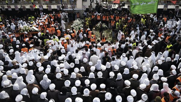 Saudi Shiites take part in a mass funeral in the mainly Shiite Saudi Gulf coastal town of Qatif, 400 kms east of Riyadh - Sputnik International