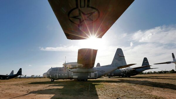 Numerous C-130 cargo planes are lined up in a field at the 309th Aerospace Maintenance and Regeneration Group boneyard at Davis-Monthan Air Force Base in Tucson, Ariz - Sputnik International