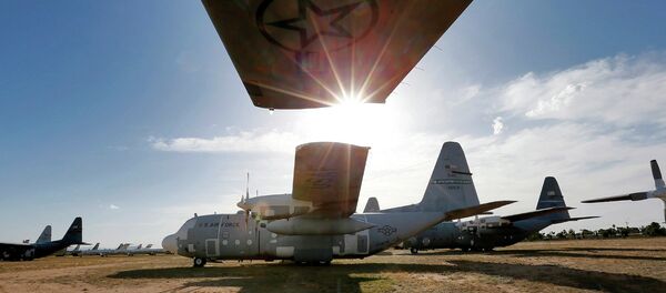 Numerous C-130 cargo planes are lined up in a field at the 309th Aerospace Maintenance and Regeneration Group boneyard at Davis-Monthan Air Force Base in Tucson, Ariz Numerous C-130 cargo planes are lined up in a field at the 309th Aerospace Maintenance and Regeneration Group boneyard at Davis-Monthan Air Force Base in Tucson, Ariz - Sputnik International