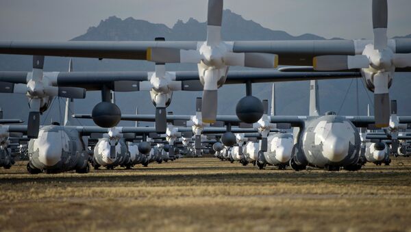 C-130 Hercules cargo planes are lined up in a field at the 309th Aerospace Maintenance and Regeneration Group boneyard at Davis-Monthan Air Force Base in Tucson, Ariz - Sputnik International
