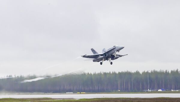 A swiss F/A-18 Hornet takes off from Kallax Airport outside Lulea, northern Sweden, May 26, 2015, during the Arctic Challenge Exercise (ACE 2015) - Sputnik International