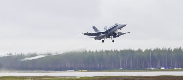 A swiss F/A-18 Hornet takes off from Kallax Airport outside Lulea, northern Sweden, May 26, 2015, during the Arctic Challenge Exercise (ACE 2015) A swiss F/A-18 Hornet takes off from Kallax Airport outside Lulea, northern Sweden, May 26, 2015, during the Arctic Challenge Exercise (ACE 2015) - Sputnik International