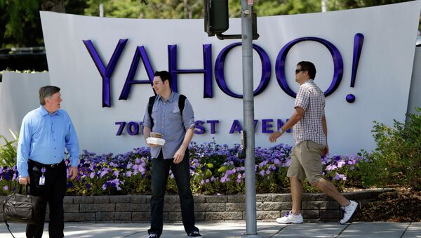 People walk in front of a Yahoo sign at the company's headquarters in Sunnyvale, California. - Sputnik International