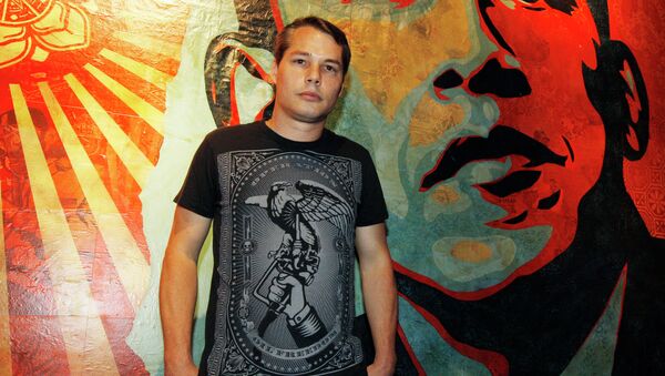 Artist Shepard Fairey poses for a portrait in front of a mural he created that was inspired by Barack Obama. - Sputnik International