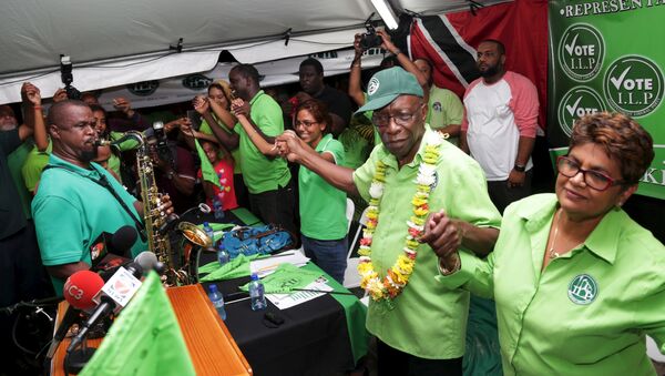 Former FIFA Vice President Jack Warner (2nd R) holds hands with supporters during a political rally organised by his Independent Liberal Party in Chaguanas, in Trinidad and Tobago, May 28, 2015 - Sputnik International