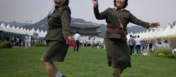 North Korean defectors wearing North Korean military uniforms dance in Gwanghwamun square during a 'unification expo' in central Seoul on May 29, 2015 North Korean defectors wearing North Korean military uniforms dance in Gwanghwamun square during a 'unification expo' in central Seoul on May 29, 2015 - Sputnik International