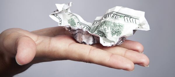 Crumpled money on a hand Crumpled money on a hand - Sputnik International
