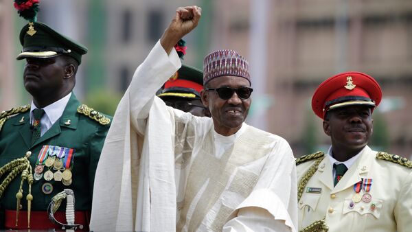 New Nigerian President, Muhammadu Buhari, salutes his supporters during his Inauguration in Abuja, Nigeria, Friday, May 29, 2015 - Sputnik International