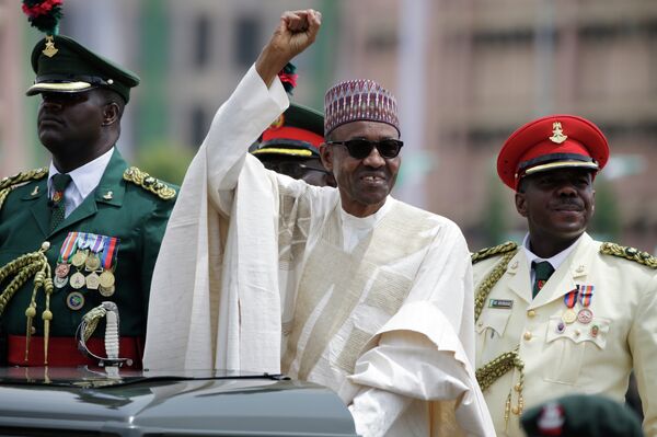 New Nigerian President, Muhammadu Buhari, salutes his supporters during his Inauguration in Abuja, Nigeria, Friday, May 29, 2015 New Nigerian President, Muhammadu Buhari, salutes his supporters during his Inauguration in Abuja, Nigeria, Friday, May 29, 2015 - Sputnik International