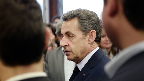 President of the French right-wing UMP party, Nicolas Sarkozy, leaves after voting at the party's headquarters in Paris, on May 28, 2015 - Sputnik International