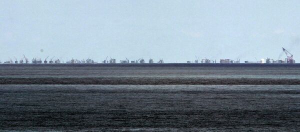 The alleged on-going reclamation of Subi Reef by China is seen from Pag-asa Island in the Spratly Islands in the South China Sea, western Palawan Province, Philippines Monday, May 11, 2015 - Sputnik International