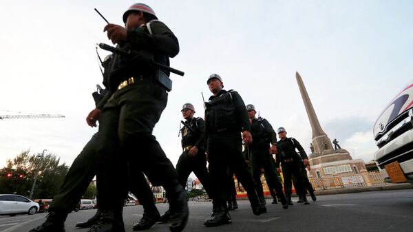 Thai military police officers march while guarding to prevent anti-coup demonstration at Victory Monument  - Sputnik International