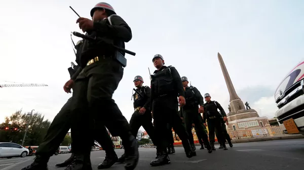 Thai military police officers march while guarding to prevent anti-coup demonstration at Victory Monument  - Sputnik International