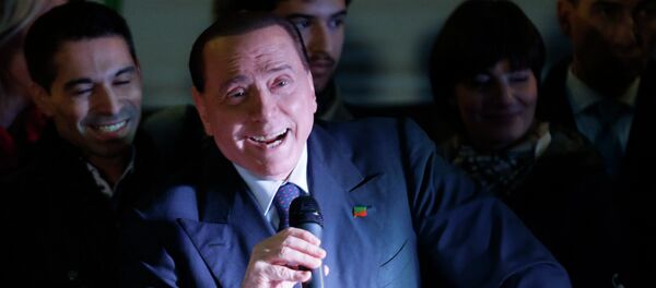Former Italian Prime Minister Silvio Berlusconi accidentally showed up at a campaign rally for a local mayoral race, asked the name of the candidate, and encouraged people to vote for him, all before realizing that he had accidentally come out in support of his party's political opponent, Italian media have reported. Photo: Berlusconi speaking during a Forza Italia party rally in Milan. File photo. - Sputnik International