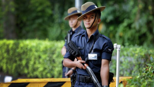 Singapore Gurkha policemen guard the grounds surrounding the venue of the 14th International Institute for Strategic Studies Shangri-la Dialogue, or IISS, Asia Security Summit, Sunday, May 31, 2015, in Singapore - Sputnik International