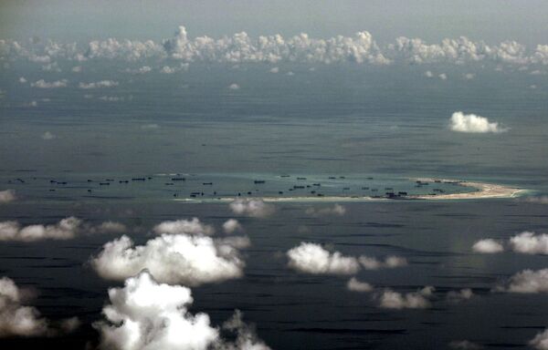 An aerial file photo taken though a glass window of a Philippine military plane shows the alleged land reclamation by China on Mischief Reef in the Spratly Islands in the South China Sea, west of Palawan, Philippines, May 11, 2015 An aerial file photo taken though a glass window of a Philippine military plane shows the alleged land reclamation by China on Mischief Reef in the Spratly Islands in the South China Sea, west of Palawan, Philippines, May 11, 2015 - Sputnik International