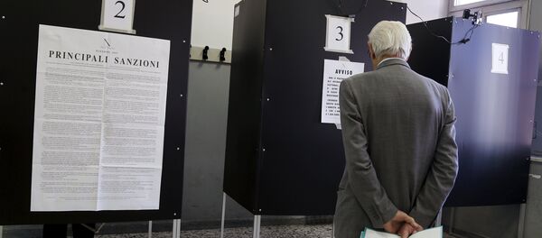 A man waits to enter a polling booth to cast his ballot at a polling station in Salerno, Italy May 31, 2015 A man waits to enter a polling booth to cast his ballot at a polling station in Salerno, Italy May 31, 2015 - Sputnik International
