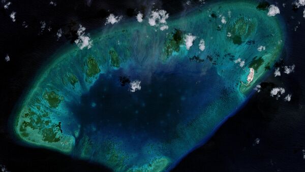 West London Reef is pictured in the South China Sea in 2015, in this handout photo provided by CSIS Asia Maritime Transparency Initiative/DigitalGlobe. New satellite images show Vietnam has carried out significant land reclamation at two sites in the disputed South China Sea, but the scale and pace of the work is dwarfed by that of China, a U.S. research institute said on May 7, 2015 - Sputnik International