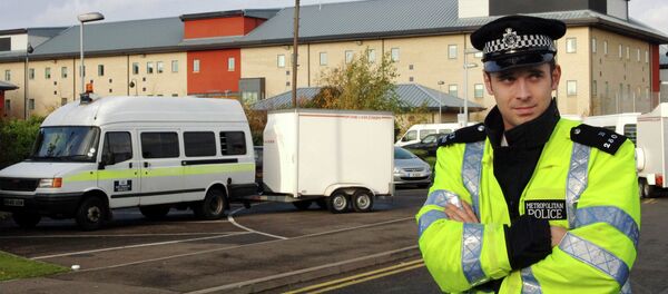 A British police officer guards the entrance to the Harmondsworth Immigration Detention Center, outside London, England. A British police officer guards the entrance to the Harmondsworth Immigration Detention Center, outside London, England. - Sputnik International