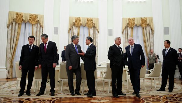 From left: Deputy Foreign Minister of Uzbekistan Anvar Nasirov, Foreign Minister of Tajikistan Sirodjidin Aslov, Foreign Minister of the Kyrgyz Republic Erlan Abdyldayev, Chinese Foreign Minister Wang Yi, Foreign Minister of the Republic of Kazakhstan Erlan Idrissov, General Secretary of Shanghai Cooperation Organisation Dmitry Mezentsev, Zhang Xinfeng, Director of Regional Anti-Terrorist Structure of the Shanghai Cooperation Organization talk before a meeting of foreign ministers of the Shanghai Cooperation Organization - Sputnik International