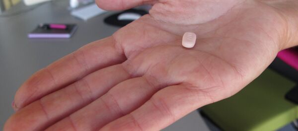 Cindy Whitehead holds a tablet of flibanserin in her office at Sprout Pharmaceuticals in Raleigh, N.C. Cindy Whitehead holds a tablet of flibanserin in her office at Sprout Pharmaceuticals in Raleigh, N.C. - Sputnik International