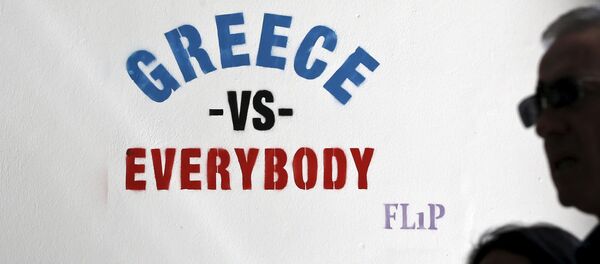 People make their way past a stencil by street artist Flip in Athens People make their way past a stencil by street artist Flip in Athens - Sputnik International