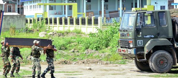Indian security personnel carry the coffin of a victim's body after postmortem in India's northeastern state Manipur, India, Friday, June 5, 2015. Indian security personnel carry the coffin of a victim's body after postmortem in India's northeastern state Manipur, India, Friday, June 5, 2015. - Sputnik International