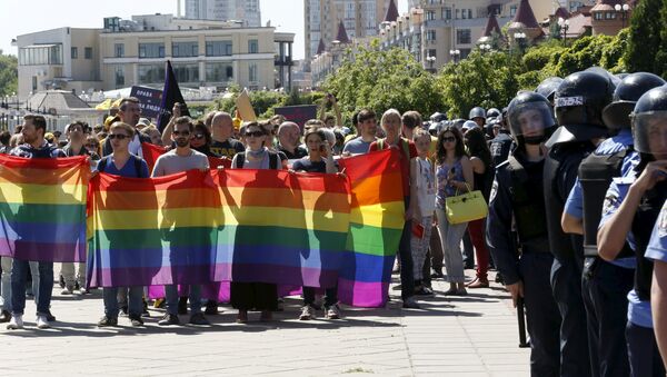 Interior Ministry members stand guard as activists take part in the so-called Equality March, organized by a lesbian, gay, bisexual and transgender (LGBT) community, in Kiev, Ukraine - Sputnik International