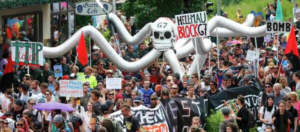 Anti-G7 protestors march during a demonstration in Garmisch-Partenkirchen, southern Germany Anti-G7 protestors march during a demonstration in Garmisch-Partenkirchen, southern Germany - Sputnik International