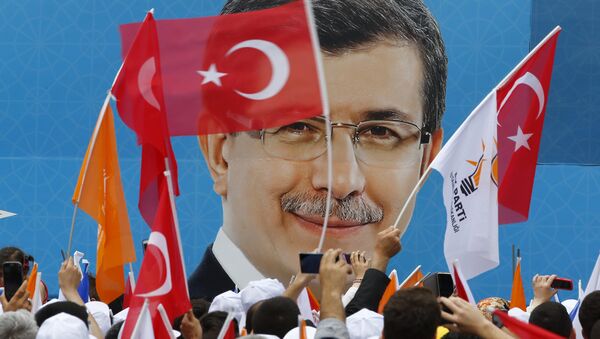 Supporters of the AK Party wave Turkish and party flags as they listen to Prime Minister Ahmet Davutoglu during an election rally for Turkey's June 7 parliamentary election in Istanbul, Turkey - Sputnik International