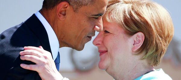 German Chancellor Angela Merkel and U.S. President Barack Obama embrace as they visit Kruen, southern Germany, June 7, 2015. Leaders from the Group of Seven (G7) industrial nations meet on Sunday in the Bavarian Alps for a summit overshadowed by Greece's debt crisis and ongoing violence in Ukraine - Sputnik International